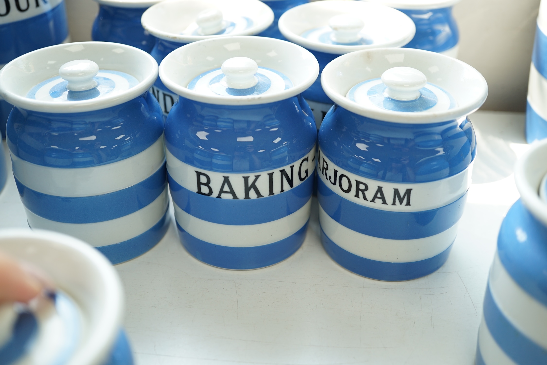 T.G.Green Cornish Kitchenware, eleven 9cm lidded storage jars to include Borax, Cayenne, Angelica, Turmeric, Ground-Ginger and Bay Leaves, Black Shield marks. Condition - poor, fair and good